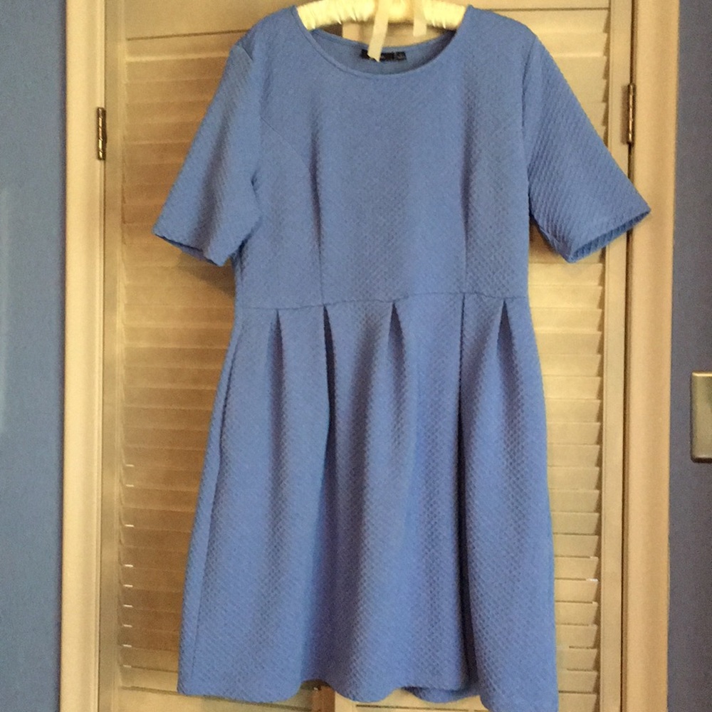 A line dress with box pleats